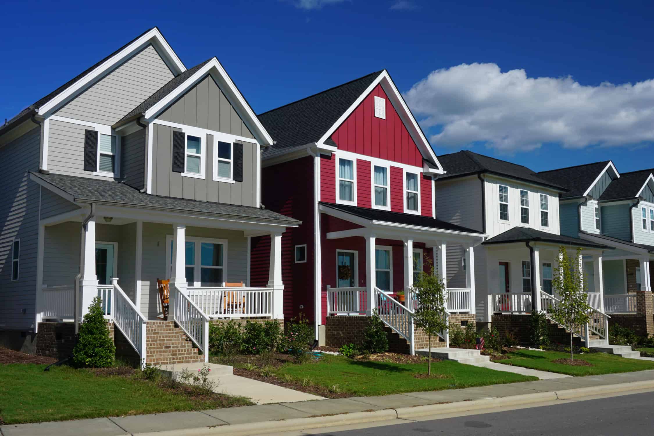 Residential Exterior Painting – Craftsman Home Color Choices | Painting Contractor in Middlesex County MA Craftsman homes in gray, bold red, and white siding with covered front porches — residential painting Middlesex County MA