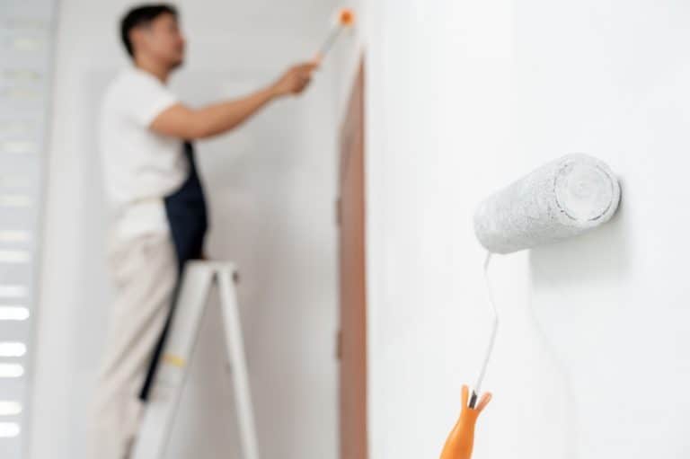 Painter Man, Brush In Hand and Roller on Wall