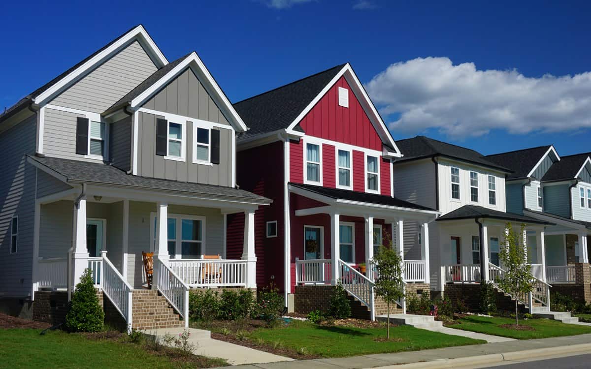 red house standing out among gray houses