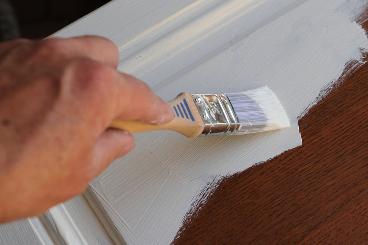 Paint a brown cabinet with white paint